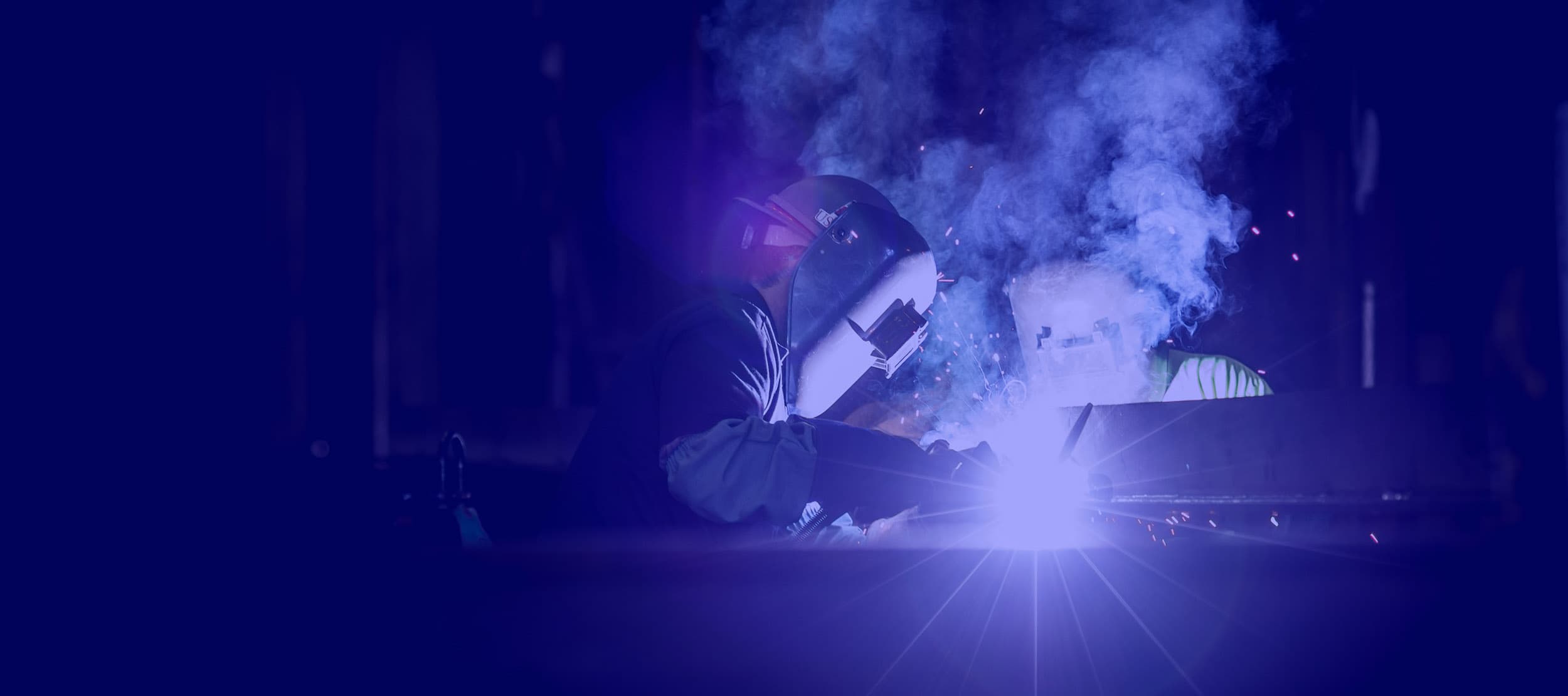 welder lighting up a weld